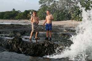 Posing at the blowhole on Playa Pelada