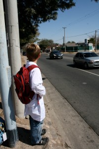 Waiting for the bus to in school attire