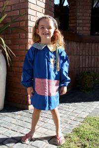 Molly on her first day of school in her "guarda polvo."